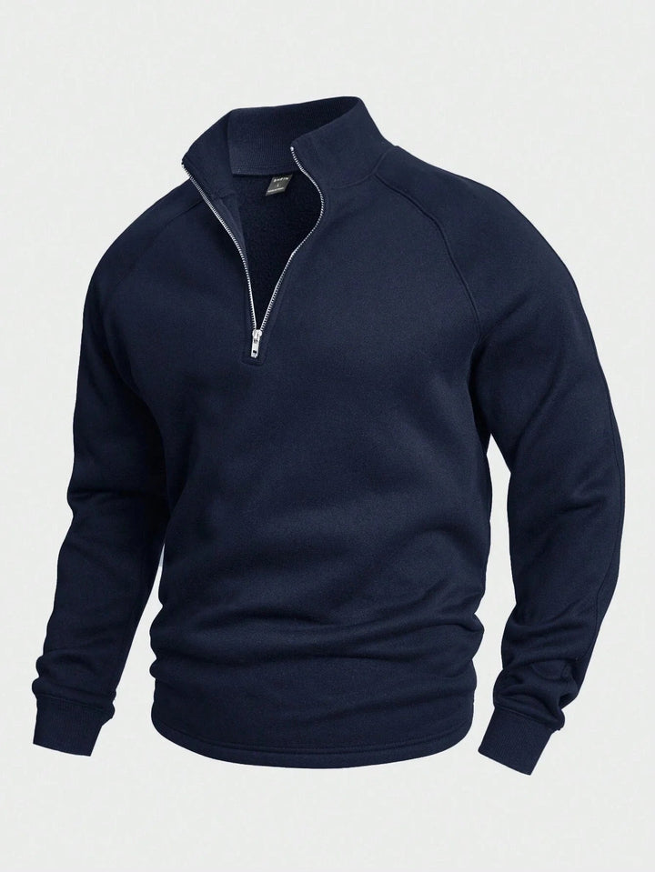 "Modern halv-zip tröja i premium bomullsmix, grå färg. Praktisk design för komfort och stil vid alla tillfällen."