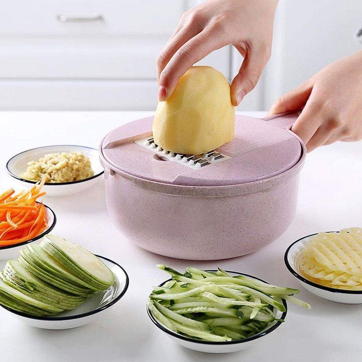 "Multifunktionell grönsaksskärare i blått och rosa med rostfritt stålblad, idealisk för snabb och enkel köksberedning."
