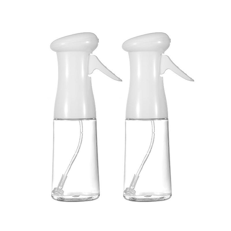 "Multifunktionell transparent oljesprayflaska i PET-plast med lufttrycksystem, svart och vit färg, för köket."