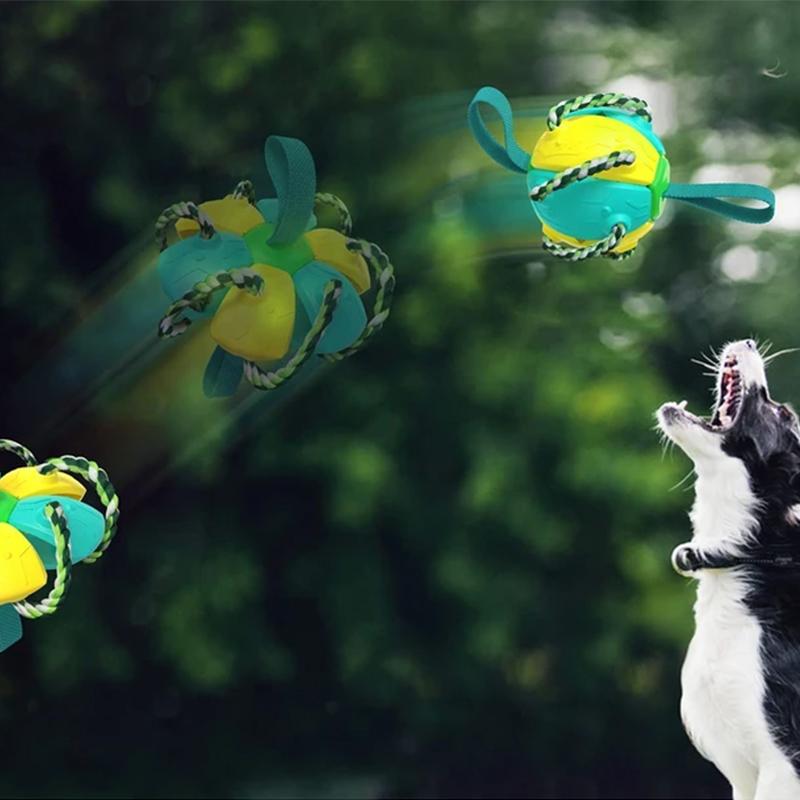 "Multifunktionell tuggig UFO-boll för hundträning med färgglada rep och gummiyta, perfekt för interaktiv lek utomhus."