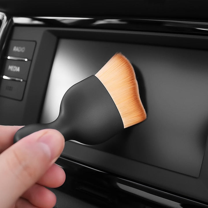 "Multifunktionellt bilrengöringsverktyg med kompaktdesign, perfekt för svåråtkomliga hörn och dammfri interiör."