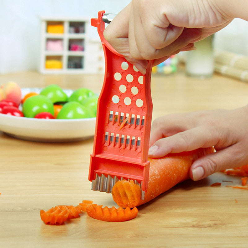 "Multifunktionellt rivjärn i rostfritt stål, ergonomisk design, för smidig peeling, riva och hacka i köket."