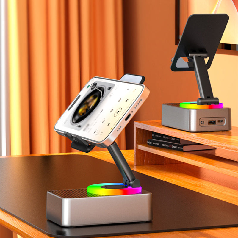 "Multifunktionellt telefonställ med Bluetooth-högtalare och powerbank, svart design med bärbar och halkfri bas."