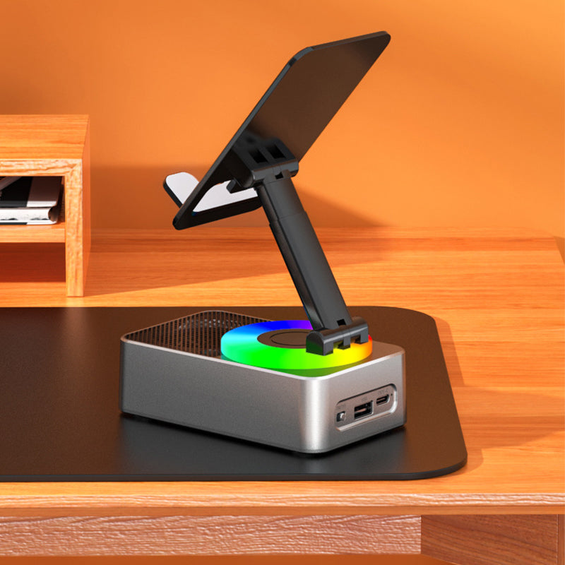 "Multifunktionellt telefonställ med Bluetooth-högtalare och powerbank, svart design med bärbar och halkfri bas."