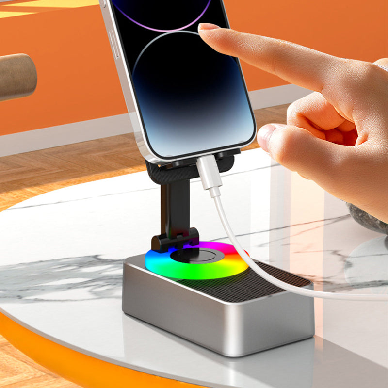 "Multifunktionellt telefonställ med Bluetooth-högtalare och powerbank, svart design med bärbar och halkfri bas."