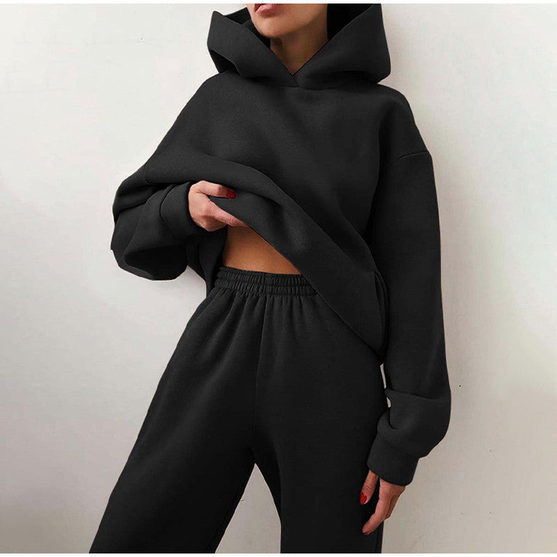 "Oversized beige damträningsdress med high waist byxa och hoodie, idealisk för stil och komfort under träning och avslappning