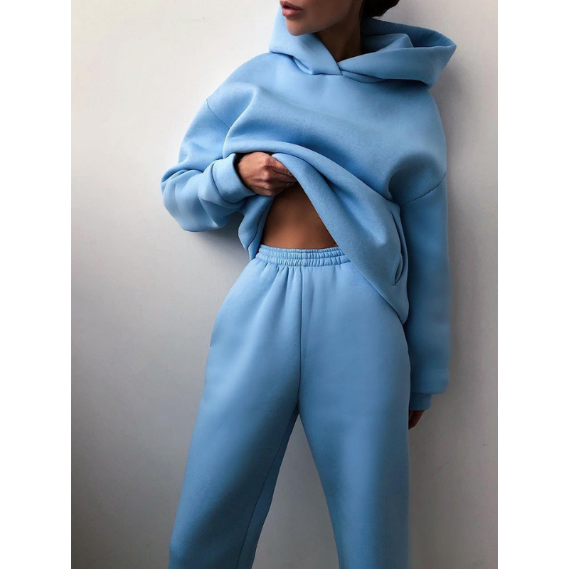 "Oversized beige damträningsdress med high waist byxa och hoodie, idealisk för stil och komfort under träning och avslappning