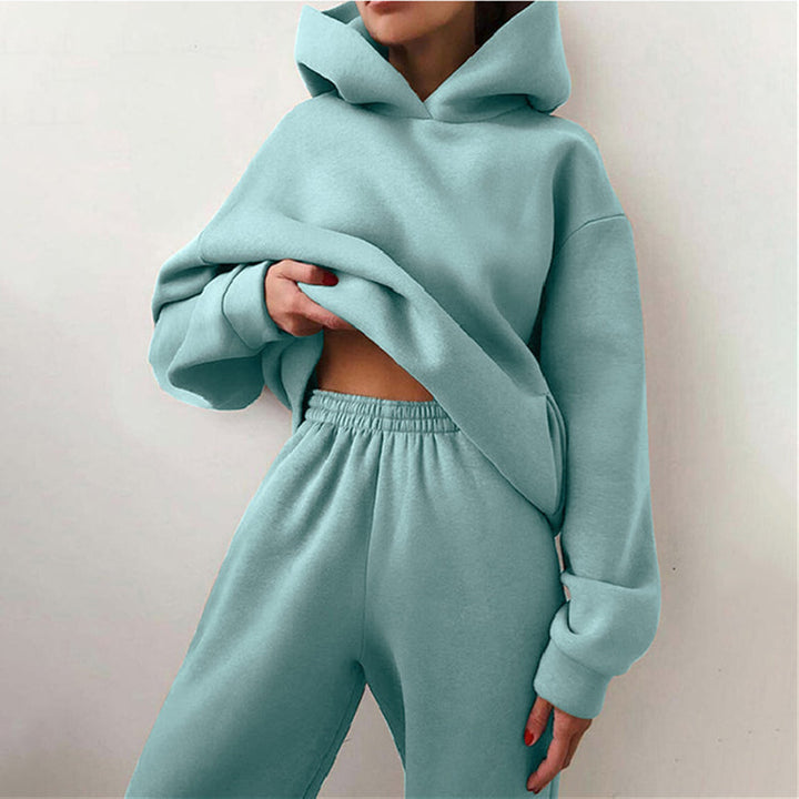 "Oversized beige damträningsdress med high waist byxa och hoodie, idealisk för stil och komfort under träning och avslappning