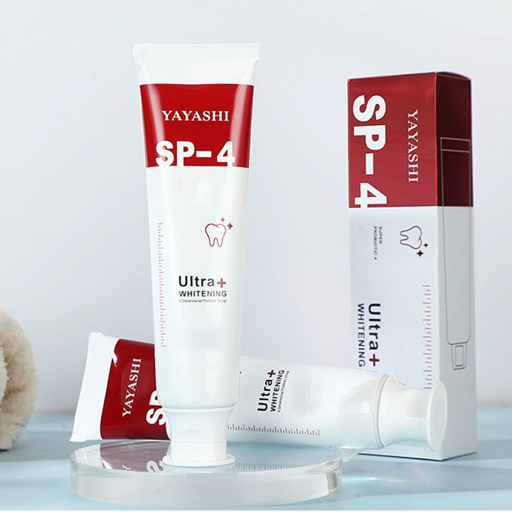 "Probiotisk tandkräm i vit tub, främjar blekning och tandhälsa, effektiv mot plack och ger fräsch andedräkt."