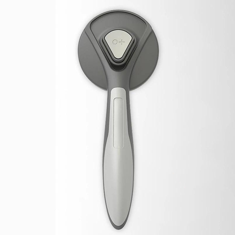 "Professionell husdjursvårdskam med stålborst, ergonomiskt grepp och rundade kanter för säker pälsvård av hundar och katter."