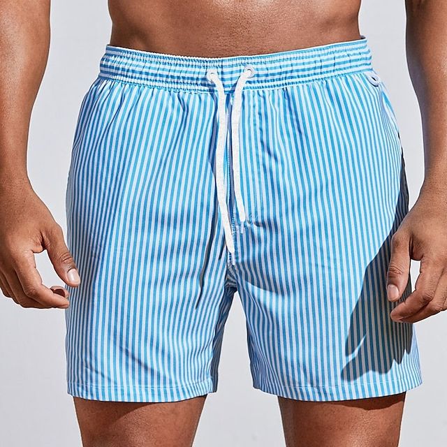 "Randiga snabbtorkande badshorts herr i bomull, blå och ljusgrön, med elastisk midja för sommarens strandäventyr"