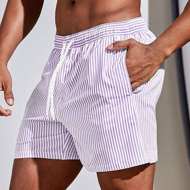 "Randiga snabbtorkande badshorts herr i bomull, blå och ljusgrön, med elastisk midja för sommarens strandäventyr"