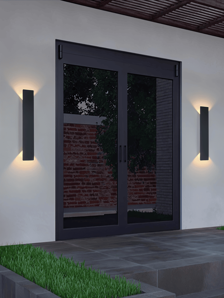 Rektangulär svart LED vägglampa i aluminium för utomhus, väderbeständig och modern design för trädgårdsbelysning.
