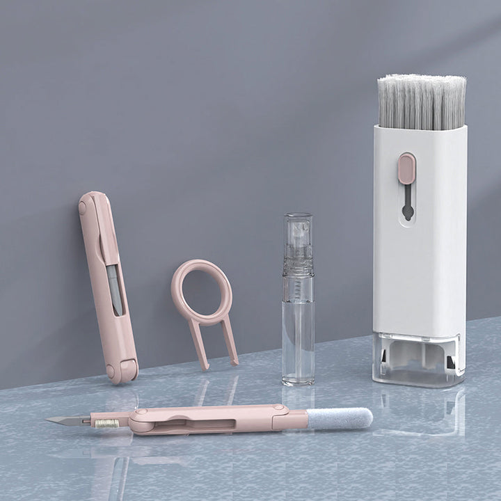 "Rosa och blå 7-i-1 rengöringssats för datorer och skärmar, innehåller borste och nyckelkapseldragare, kompakt design."