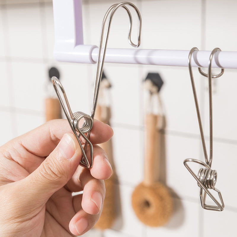 "Rostfri metalklämma med lång svans, silverfärgad, perfekt för kök och badrum, hållbar design för smart förvaring."