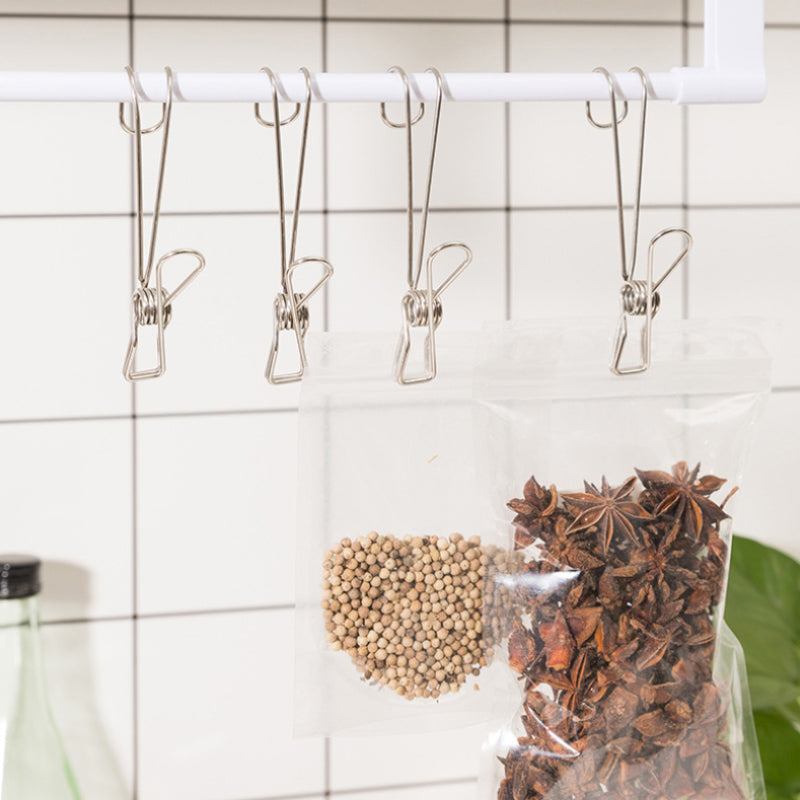 "Rostfri metalklämma med lång svans, silverfärgad, perfekt för kök och badrum, hållbar design för smart förvaring."