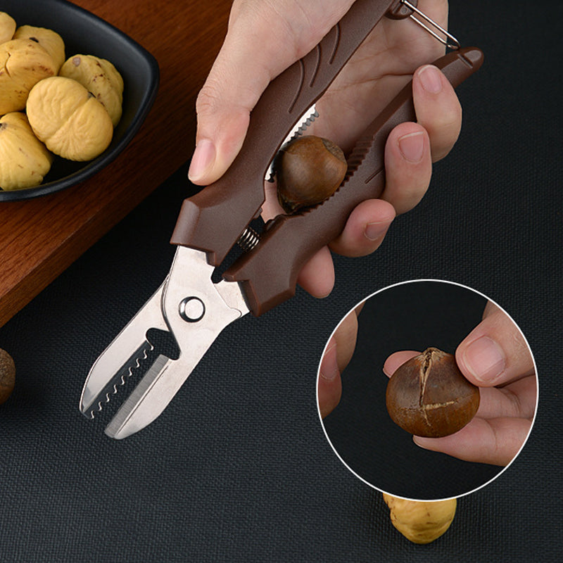 "Rostfri nötöppnare med brun detaljer, ergonomisk design för enkel öppning av valnötter och kastanjer i köket."