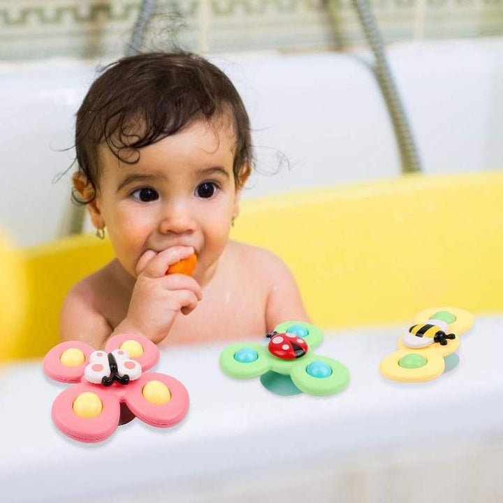 "Roterande insektsbadleksak för barn, färgglad och av ABS-plast, fästbar på släta ytor med sugkopp."