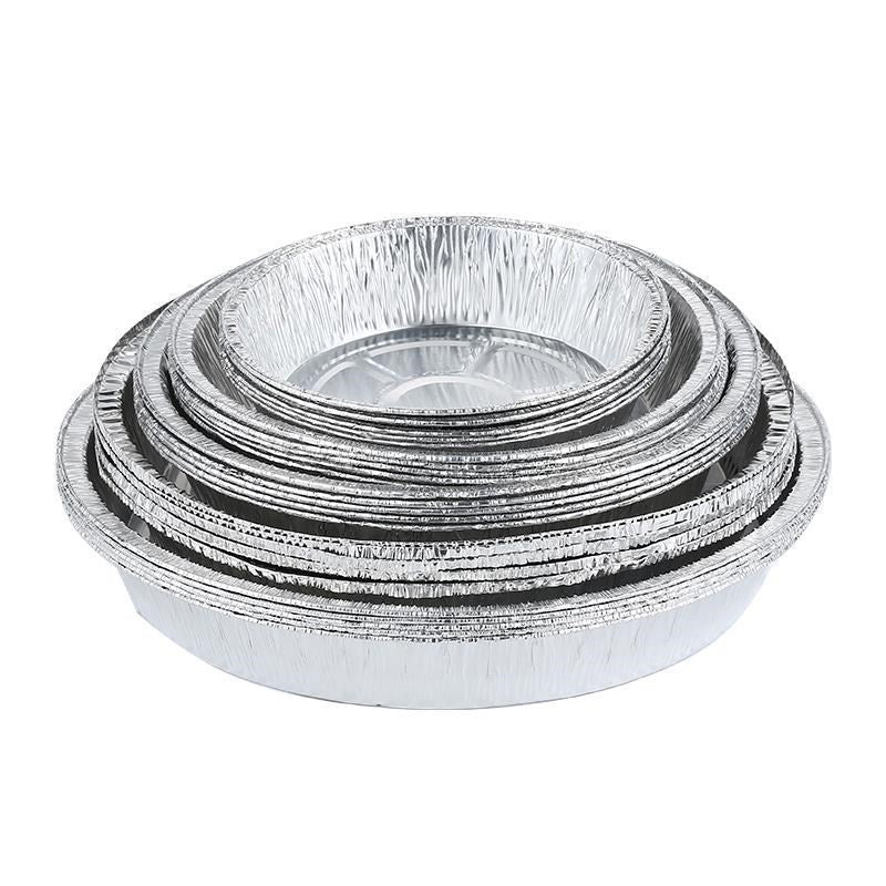 Rund foliebricka i aluminium, slittålig och skålformad, idealisk för mikrovågsugn och air fryer, förenklar matlagning.