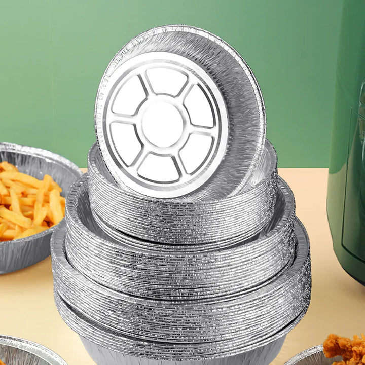 Rund foliebricka i aluminium, slittålig och skålformad, idealisk för mikrovågsugn och air fryer, förenklar matlagning.