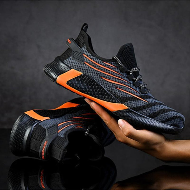 "Säkerhetsskor för män med ståltåhätta, mörk färg, halksäker sula, idealisk för arbetsmiljö, robust design."