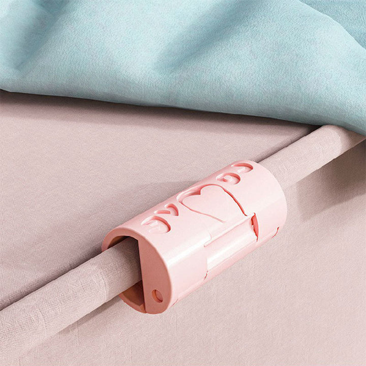 "Sänglakanhållare utan nålar i blå och rosa, funktionell och stilren, av slitstarkt ABS-material för prydligt sovrum."
