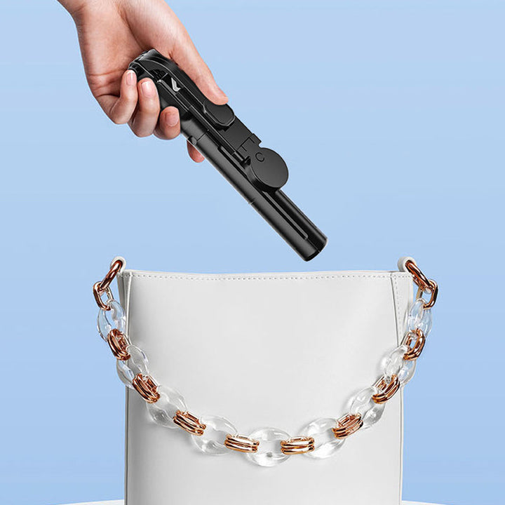 "Selfiepinne med dimbart LED-ljus och Bluetooth-fjärrkontroll, svart och vit, kompakt och bärbar, perfekt för nattbilder."