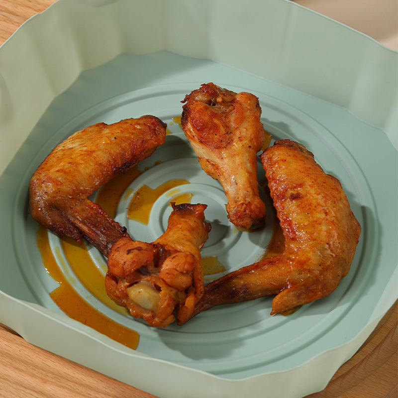 "Silikonbakbrickor för luftfritös i olika färger, perfekta för köket, hållbara och enkla att rengöra."