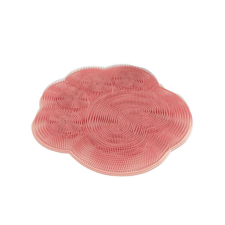 "Silikonmatta med sugkoppar och mjuka borstar för fotvård. Stabil och exfolierande, perfekt för spa-liknande hemupplevelse."