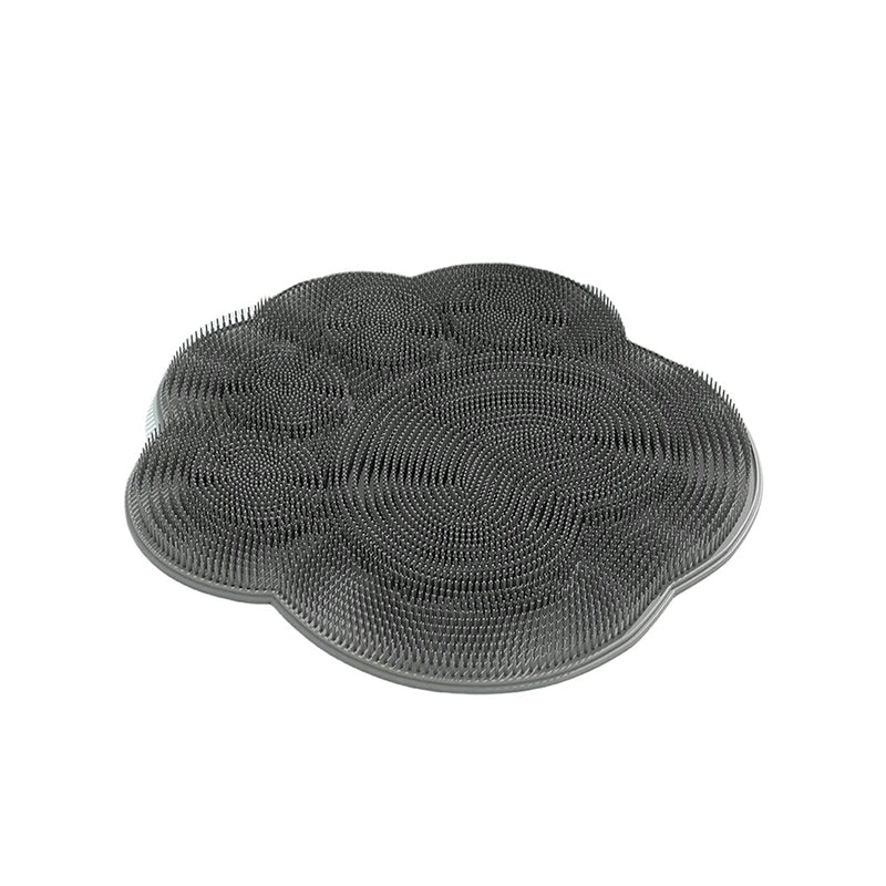 "Silikonmatta med sugkoppar och mjuka borstar för fotvård. Stabil och exfolierande, perfekt för spa-liknande hemupplevelse."