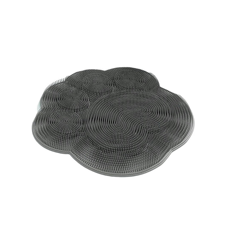 "Silikonmatta med sugkoppar och mjuka borstar för fotvård. Stabil och exfolierande, perfekt för spa-liknande hemupplevelse."