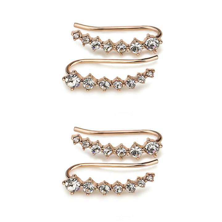 "Sju-stjärniga stiftörhängen med kristaller i guld, eleganta accessoarer för kvinnor, glänsande och sofistikerad design."