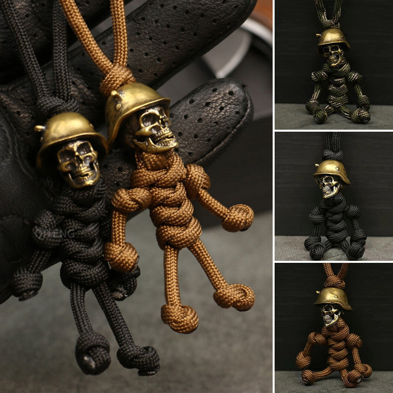 "Skelet soldat nyckelring i koppar och paracord, robust design med slitstark tygfläta och unik kopparlook."