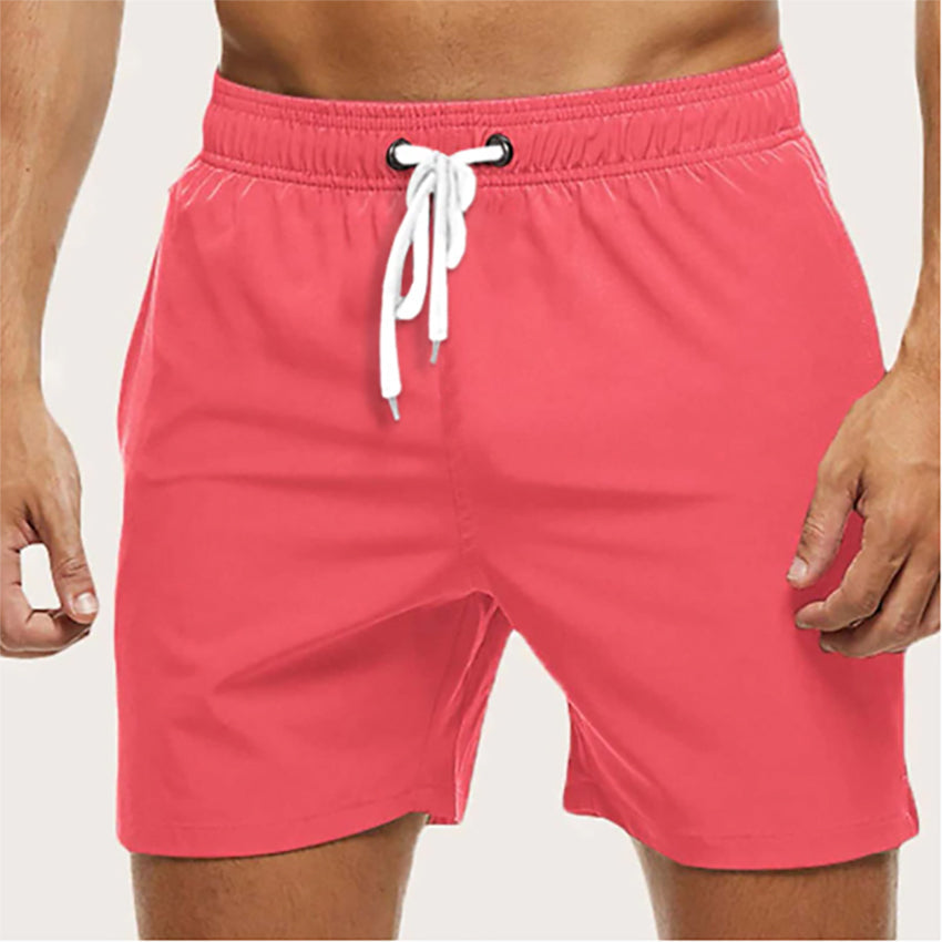"Snabbtorkande badshorts i grått med ljusblå detaljer, elastisk midja och trendig design för män på sommaren."