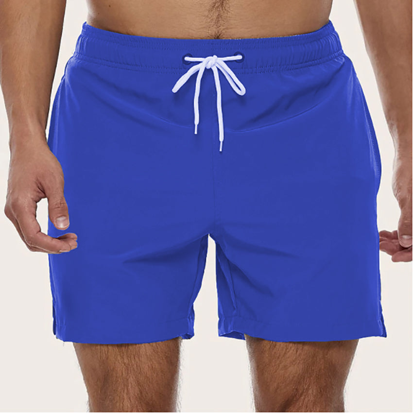 "Snabbtorkande badshorts i grått med ljusblå detaljer, elastisk midja och trendig design för män på sommaren."