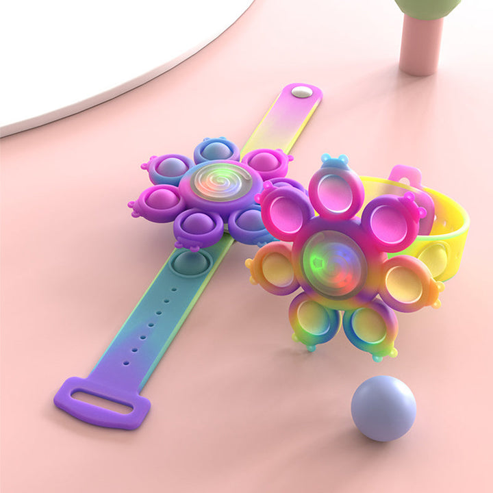 "Snurrande LED-poppande sensoriskt armband i silikon med ljus, perfekt för stil och stresslindring, färgglad och flexibel."