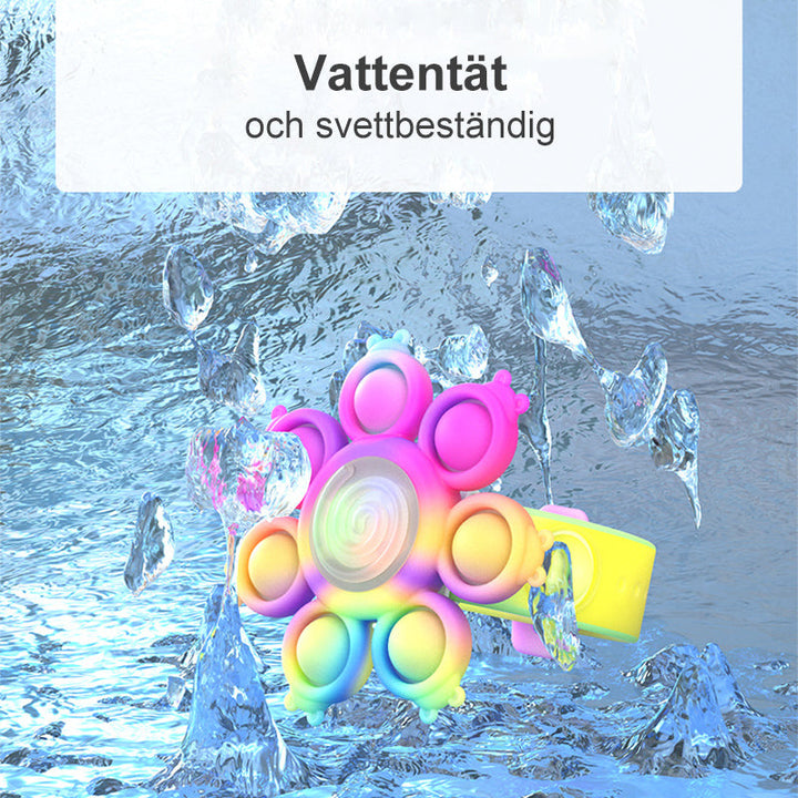 "Snurrande LED-poppande sensoriskt armband i silikon med ljus, perfekt för stil och stresslindring, färgglad och flexibel."