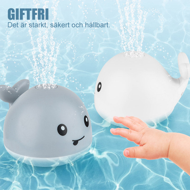 "Söt 2 i 1 vattenspray badleksak för barn i valform med blinkande ljus och roterande funktion för roligt bad."