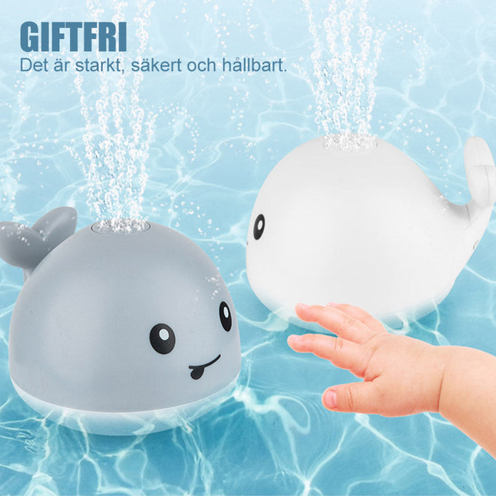 "Söt 2 i 1 vattenspray badleksak för barn i valform med blinkande ljus och roterande funktion för roligt bad."
