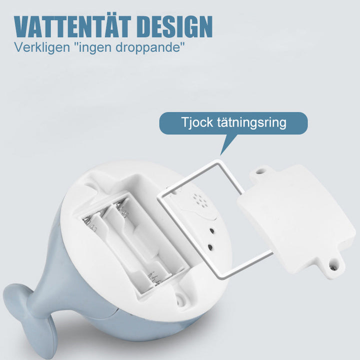 "Söt 2 i 1 vattenspray badleksak för barn i valform med blinkande ljus och roterande funktion för roligt bad."