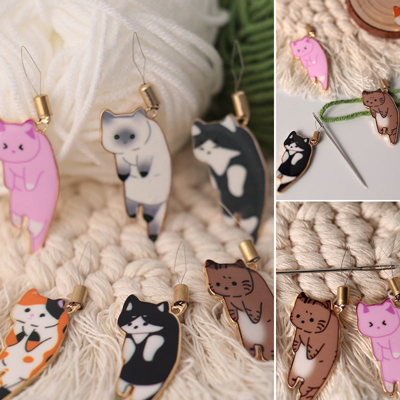"Söt katt nålgängare i olika färger för enkel nålträdning, funktionell och stilfull accessoar för broderi."