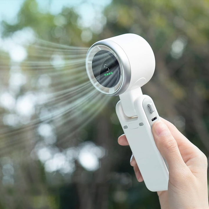 "Stilfull hopfällbar handhållen turbinfläkt, kompakt för resor och hem. 180° justerbar med 3-i-1 funktion."