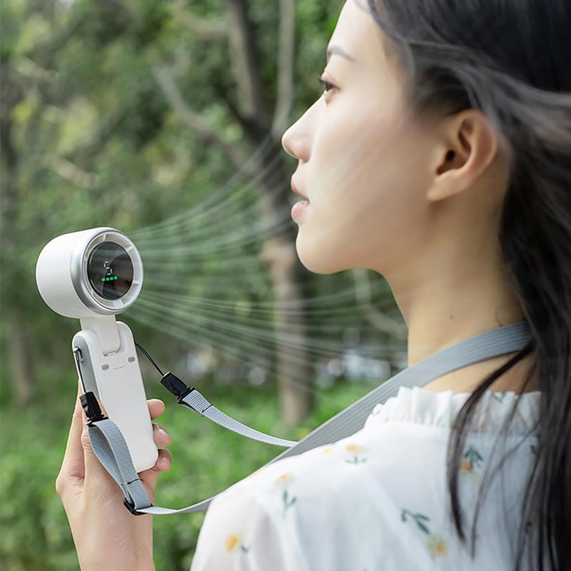 "Stilfull hopfällbar handhållen turbinfläkt, kompakt för resor och hem. 180° justerbar med 3-i-1 funktion."