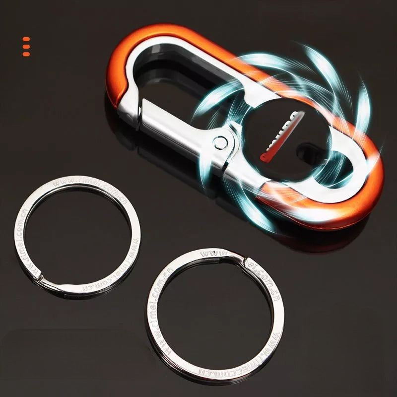 "Stilren bilnyckelring av zinklegering och rostfritt stål för män, med elegant design och dubbla ringar."