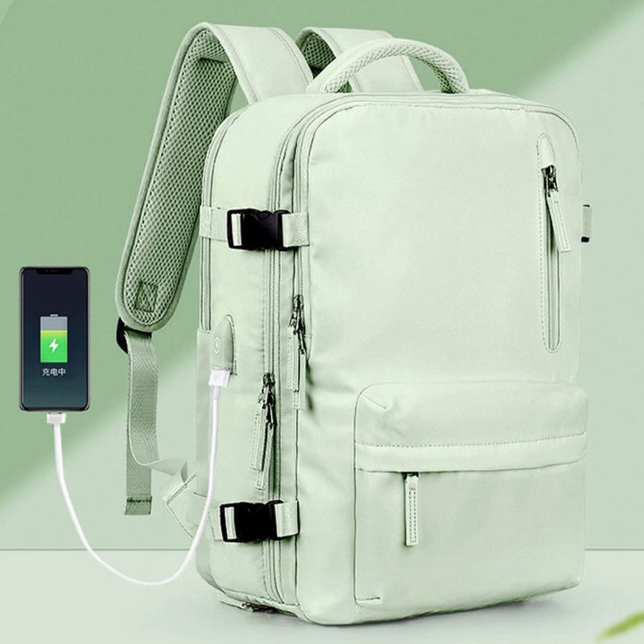 "Stor kvinnlig multifunktionell ryggsäck, vattentät och stilren med gröna, rosa och svarta nyanser, idealisk för resor."