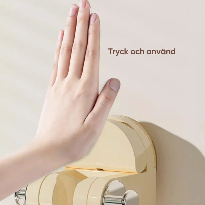 "Sugkopp duschtillbehör i silver och transparent ABS-material, justerbar krok för duschmunstycke, stilren badrumsdesign."