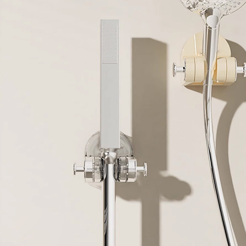 "Sugkopp duschtillbehör i silver och transparent ABS-material, justerbar krok för duschmunstycke, stilren badrumsdesign."