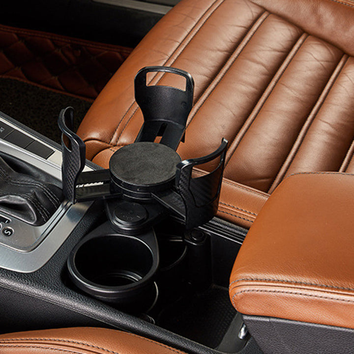 "Svart modern bil mugghållare med justerbar bas och shockproof kuddar, kompakt design för två drycker, 360° roterbar."