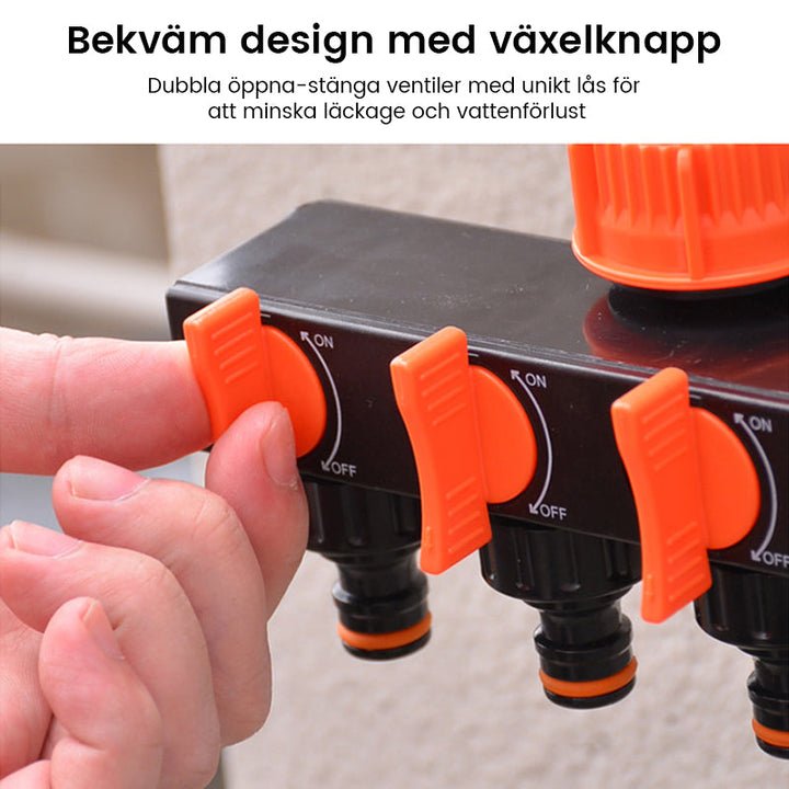 "Svart och orange trädgårdsslangsplitt med fyra snabbkopplingar, idealisk för bevattningsuppgifter i små och stora trädgårdar