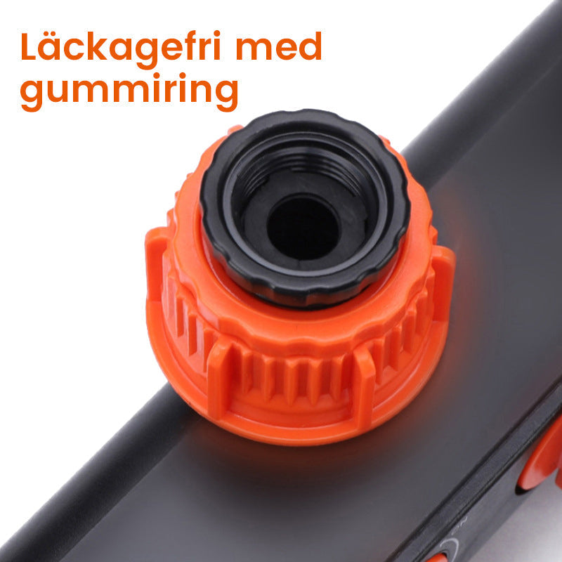 "Svart och orange trädgårdsslangsplitt med fyra snabbkopplingar, idealisk för bevattningsuppgifter i små och stora trädgårdar
